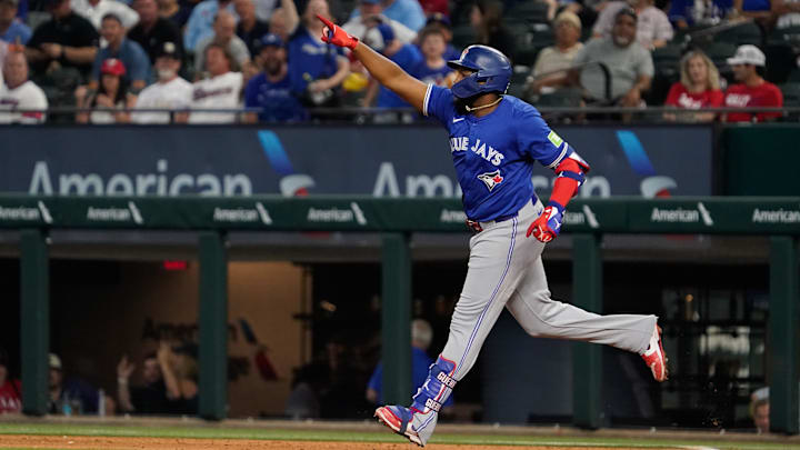 Sep 19, 2024; Arlington, Texas, USA; Toronto Blue Jays first baseman Vladimir Guerrero Jr. (27) reacts after hitting a solo home run during the ninth inning against the Texas Rangers at Globe Life Field.