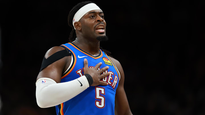 Jan 4, 2026; Phoenix, Arizona, USA; Oklahoma City Thunder guard Luguentz Dort (5) against the Phoenix Suns at Mortgage Matchup Center. Mandatory Credit: Mark J. Rebilas-Imagn Images