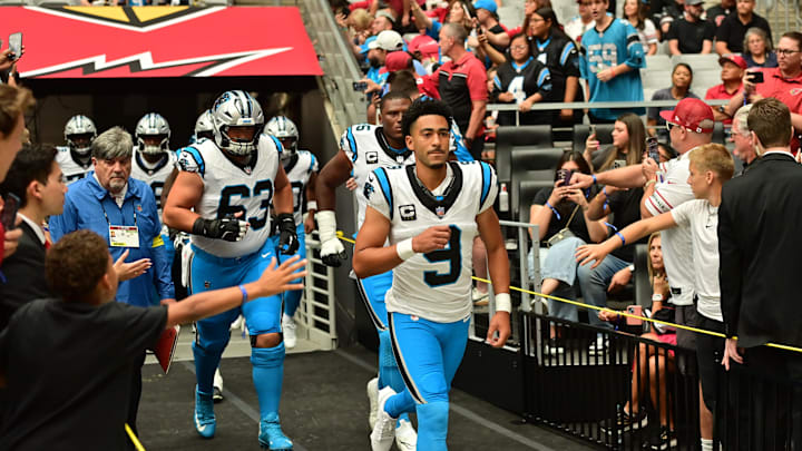 Sep 14, 2025; Glendale, Arizona, USA;  Carolina Panthers player are lead out onto the field by quarterback Bryce Young (9) prior to the first half against the Arizona Cardinals at State Farm Stadium. Mandatory Credit: Matt Kartozian-Imagn Images