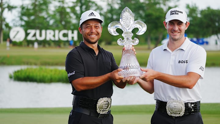 Apr 24, 2022; Avondale, Louisiana, USA; Xander Schauffele (left) and Patrick Cantlay (right) hold up
