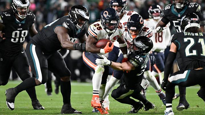 Nov 28, 2025; Philadelphia, Pennsylvania, USA; Chicago Bears running back Kyle Monangai (25) carries the ball defended by Philadelphia Eagles defensive tackle Jordan Davis (90) and safety Reed Blankenship (32) during the fourth quarter of the game at Lincoln Financial Field. Mandatory Credit: Eric Hartline-Imagn Images