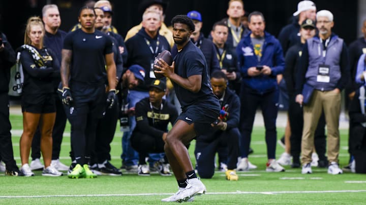 Colorado Buffaloes quarterback Shedeur Sanders looks to make a pass at the University of Colorado NFL Showcase at the CU Indoor Practice Facility. Mandatory Credit: Michael Ciaglo-Imagn Images