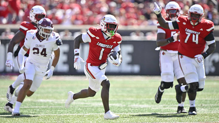 Aug 30, 2025; Louisville, Kentucky, USA; Louisville Cardinals running back Isaac Brown (1) runs the ball against Eastern Kentucky Colonels linebacker Kaden Smith (24) during the first half at L&N Federal Credit Union Stadium. Mandatory Credit: Jamie Rhodes-Imagn Images Aug 30, 2025; Louisville, Kentucky, USA; Louisville Cardinals running back Isaac Brown (1) runs the ball against Eastern Kentucky Colonels linebacker Kaden Smith (24) during the first half at L&N Federal Credit Union Stadium. Mandatory Credit: Jamie Rhodes-Imagn Images