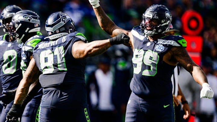 Leonard Williams (99) and Byron Murphy II (91) of the Seattle Seahawks celebrate during the third quarter of the game against the New Orleans Saints at Lumen Field on September 21, 2025 in Seattle, Washington. Leonard Williams (99) and Byron Murphy II (91) of the Seattle Seahawks celebrate during the third quarter of the game against the New Orleans Saints at Lumen Field on September 21, 2025 in Seattle, Washington.