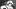 Seated on the mirrored staircase at 31 Rue Cambon, Chanel wears a tweed skirt suit, hat, and cat-eye glasses as she watches h Seated on the mirrored staircase at 31 Rue Cambon, Chanel wears a tweed skirt suit, hat, and cat-eye glasses as she watches h