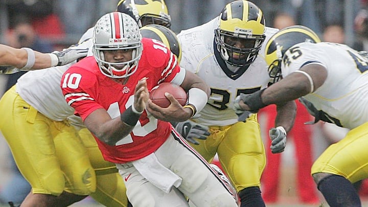 Ohio State's Troy Smith, 10, tries to keep in front of Michigan's defense in the first half of their game at the Ohio Stadium, November 18, 2006.