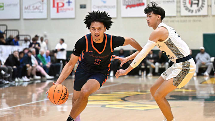 Eastvale Roosevelt guard Brayden Burries blows past a St. John Bosco defender in a 56-55 overtime win to take the Damien Classic on 12/30/2024.