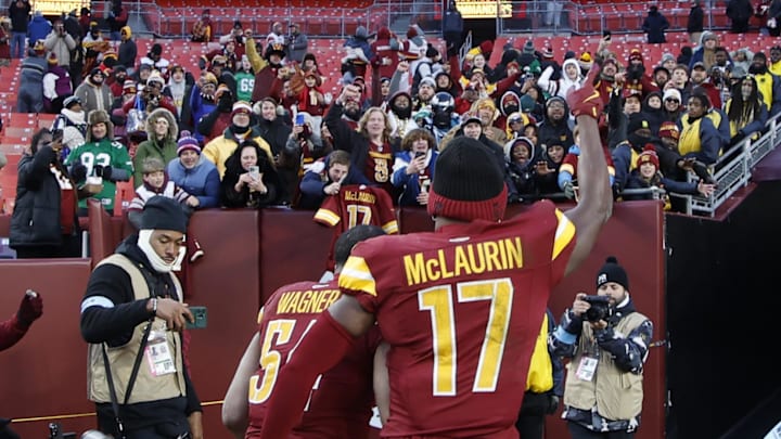 Dec 22, 2024; Landover, Maryland, USA; Washington Commanders wide receiver Terry McLaurin (17) celebrates while leaving the field with Commanders linebacker Bobby Wagner (54) after their game against the Philadelphia Eagles at Northwest Stadium. Mandatory Credit: Geoff Burke-Imagn Images
