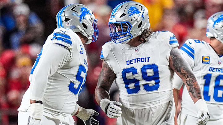 Detroit Lions offensive tackle Penei Sewell (58), left, talks to guard Tate Ratledge (69) before a play against Kansas City Chiefs during the second half at Arrowhead Stadium in Kansas City, Missouri on Sunday, Oct. 12, 2025. Detroit Lions offensive tackle Penei Sewell (58), left, talks to guard Tate Ratledge (69) before a play against Kansas City Chiefs during the second half at Arrowhead Stadium in Kansas City, Missouri on Sunday, Oct. 12, 2025.