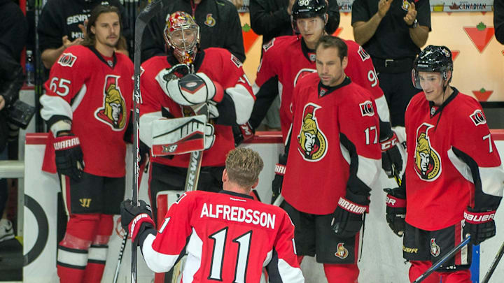 Dec 4, 2014; Ottawa, Ontario, CAN; Ottawa Senators former player Daniel Alfredsson (11) skates with the team during warmup prior to game against the New York Islanders at Canadian Tire Centre. Mandatory Credit: Marc DesRosiers-USA TODAY Sports