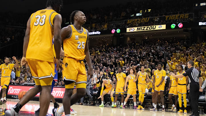 Dec 8, 2024; Columbia, Missouri, USA; Missouri Tigers forward Mark Mitchell (25) and center Josh Gray (33) celebrates with the bench after an important bucket late in the game at Mizzou Arena. Dec 8, 2024; Columbia, Missouri, USA; Missouri Tigers forward Mark Mitchell (25) and center Josh Gray (33) celebrates with the bench after an important bucket late in the game at Mizzou Arena.