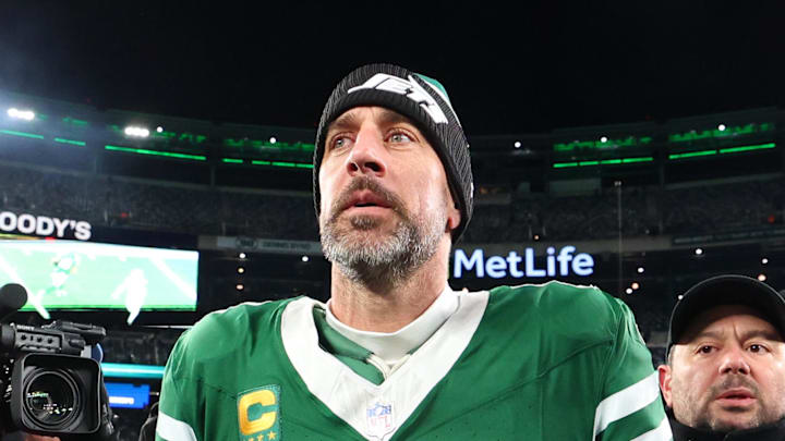 New York Jets quarterback Aaron Rodgers walks on the field after a win over the Miami Dolphins.