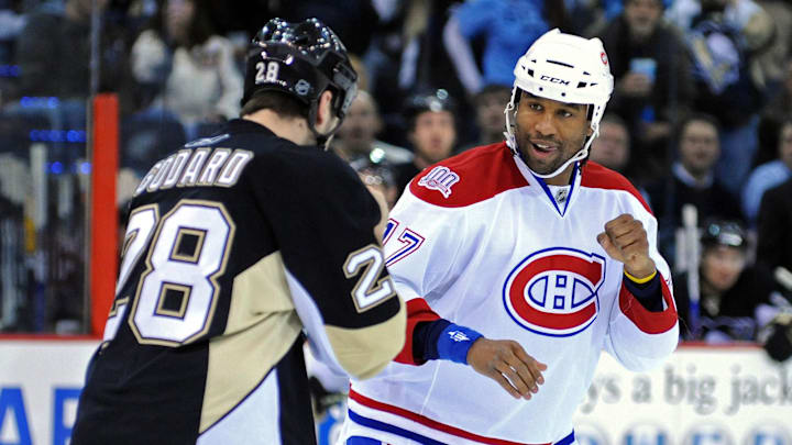 Feb 19, 2009; Pittsburgh, PA, USA; Montreal Canadiens wing Georges Laraque (17) fights with Pittsburgh Penguins wing Eric Godard (28) during the first period at Mellon Arena. Mandatory Credit: Dave Miller-Imagn Images