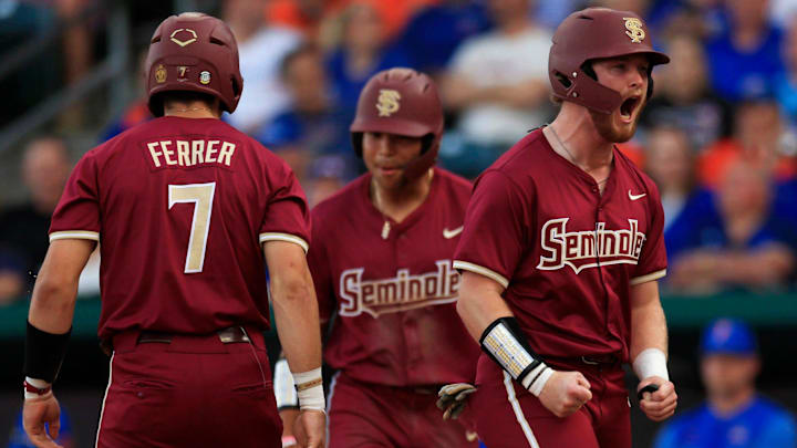 Florida State outfielder James Tibbs III (22) gets fired up after a score during the first inning of