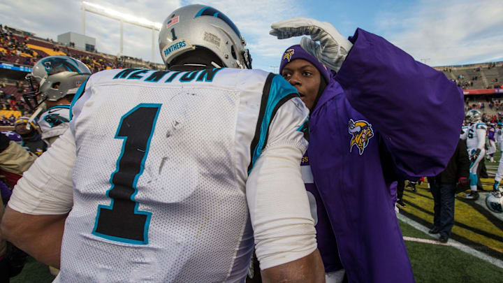 Nov 30, 2014; Minneapolis, MN, USA; Carolina Panthers quarterback Cam Newton (1) talks with Minnesota Vikings quarterback Teddy Bridgewater (5) following the game at TCF Bank Stadium. The Vikings defeated the Panthers 31-13. 