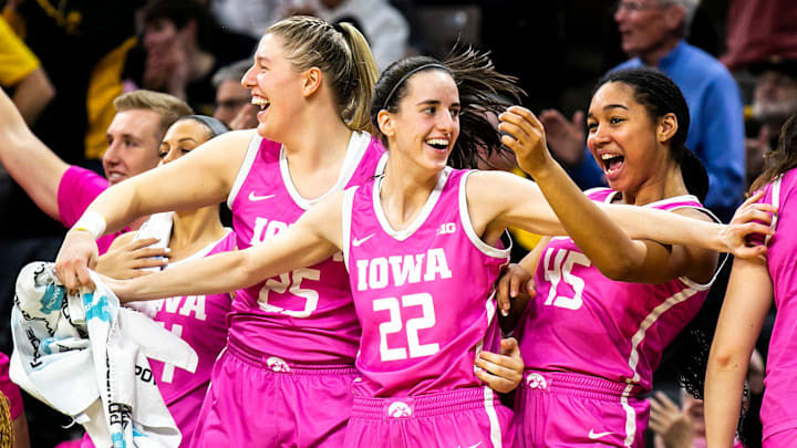 Iowa guard Caitlin Clark (22) center Monika Czinano, left, and forward Hannah Stuelke celebrate during a NCAA Big Ten Conference women's basketball game against Rutgers, Sunday, Feb. 12, 2023, at Carver-Hawkeye Arena in Iowa City, Iowa. Iowa guard Caitlin Clark (22) center Monika Czinano, left, and forward Hannah Stuelke celebrate during a NCAA Big Ten Conference women's basketball game against Rutgers, Sunday, Feb. 12, 2023, at Carver-Hawkeye Arena in Iowa City, Iowa.