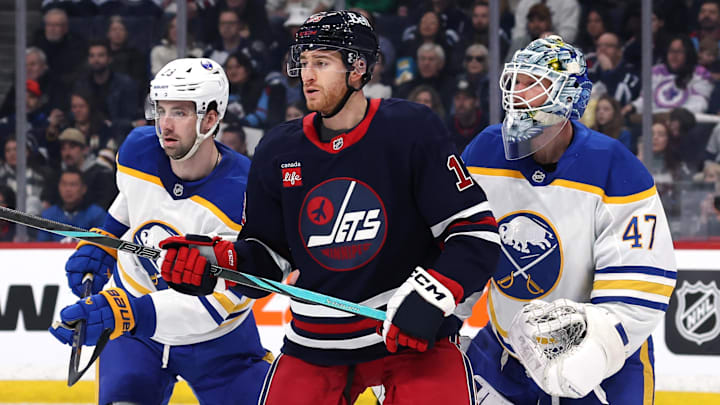 Mar 23, 2025; Winnipeg, Manitoba, CAN; Buffalo Sabres defenseman Mattias Samuelsson (23), Winnipeg Jets center Gabriel Vilardi (13) and Buffalo Sabres goaltender James Reimer (47) wait for an incoming shot in the second period at Canada Life Centre. Mandatory Credit: James Carey Lauder-Imagn Images Mar 23, 2025; Winnipeg, Manitoba, CAN; Buffalo Sabres defenseman Mattias Samuelsson (23), Winnipeg Jets center Gabriel Vilardi (13) and Buffalo Sabres goaltender James Reimer (47) wait for an incoming shot in the second period at Canada Life Centre. Mandatory Credit: James Carey Lauder-Imagn Images