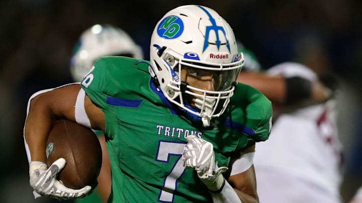 Green Bay Notre Dame's Kingston Allen (7) runs the ball in for a touchdown during a football game against De Pere High School on Aug. 29, 2025, in Green Bay, Wis. Green Bay Notre Dame defeated De Pere 42-30.