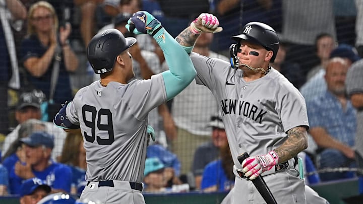 Jun 11, 2024; Kansas City, Missouri, USA; New York Yankees center fielder Aaron Judge (99) celebrates with Alex Verdugo (24) after hitting a two-run home run in the seventh inning against the Kansas City Royals at Kauffman Stadium.