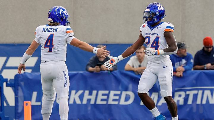 Boise State running back Dylan Riley (24) and quarterback Maddux Madsen. Boise State running back Dylan Riley (24) and quarterback Maddux Madsen.
