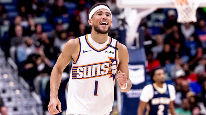 Dec 5, 2024; New Orleans, Louisiana, USA;  Phoenix Suns guard Devin Booker (1) reacts to having foul called against him against the New Orleans Pelicans during the second half  at Smoothie King Center. Mandatory Credit: Stephen Lew-Imagn Images