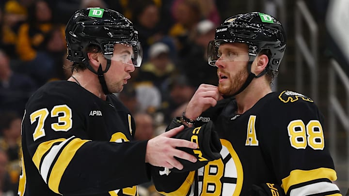 Mar 24, 2026; Boston, Massachusetts, USA; Boston Bruins defenseman Charlie McAvoy (73) talks with right wing David Pastrnak (88) during the third period against the Toronto Maple Leafs at TD Garden. Mandatory Credit: Winslow Townson-Imagn Images