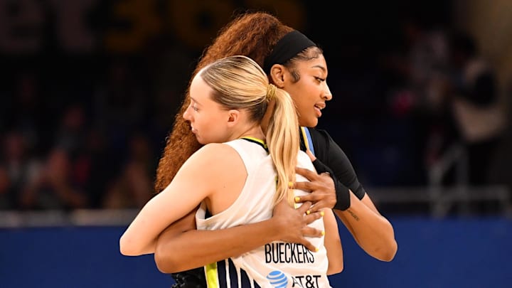 May 29, 2025; Chicago, Illinois, USA; Chicago Sky forward Angel Reese (5) and Dallas Wings guard Paige Bueckers (5) hug prior to a game at the Wintrust Arena. Mandatory Credit: Patrick Gorski-Imagn Images
