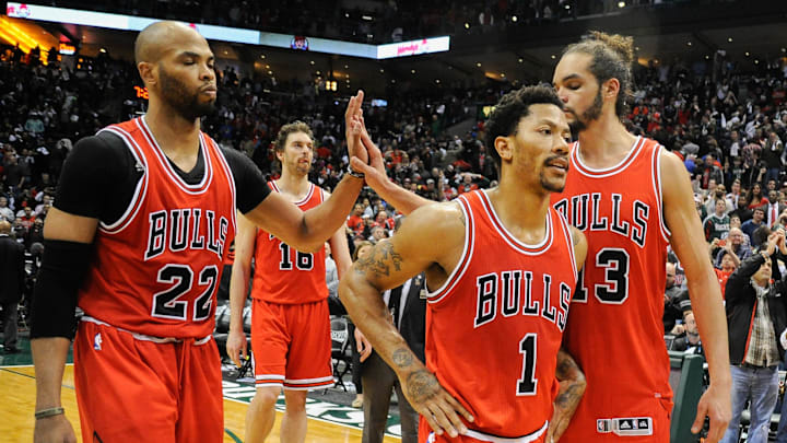 Apr 25, 2015; Milwaukee, WI, USA; Chicago Bulls forward Taj Gibson (22) and guard Derrick Rose (1) and center Joakim Noah (13) walks off the court after the Milwaukee Bucks beat the Bulls 92-90 in game four of the first round of the NBA Playoffs at BMO Harris Bradley Center. Mandatory Credit: Benny Sieu-Imagn Images