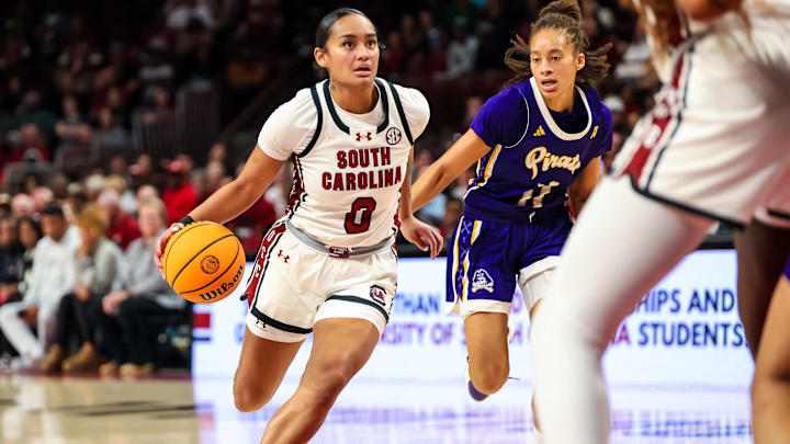 Nov 17, 2024; Columbia, South Carolina, USA; South Carolina Gamecocks guard Te-Hina Paopao (0) drives around East Carolina Lady Pirates guard Khia Miller (11) in the second half at Colonial Life Arena. Mandatory Credit: Jeff Blake-Imagn Images