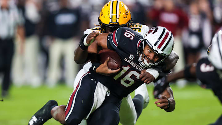 Nov 16, 2024; Columbia, South Carolina, USA; South Carolina Gamecocks quarterback LaNorris Sellers (16) is brought down by Missouri Tigers defensive end Jaylen Brown (93) in the second half at Williams-Brice Stadium. Mandatory Credit: Jeff Blake-Imagn Images