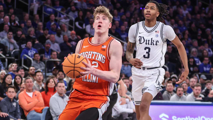 Feb 22, 2025; New York, NY, USA;  Illinois Fighting Illini guard Kasparas Jakucionis (32) drives past Duke Blue Devils guard Isaiah Evans (3) in the second half at Madison Square Garden. Mandatory Credit: Wendell Cruz-Imagn Images