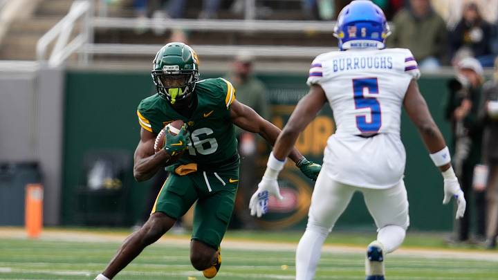 Nov 30, 2024; Waco, Texas, USA; Baylor Bears wide receiver Hal Presley (16) runs after a catch against Kansas Jayhawks safety O.J. Burroughs (5) during the first half at McLane Stadium. Mandatory Credit: Chris Jones-Imagn Images Nov 30, 2024; Waco, Texas, USA; Baylor Bears wide receiver Hal Presley (16) runs after a catch against Kansas Jayhawks safety O.J. Burroughs (5) during the first half at McLane Stadium. Mandatory Credit: Chris Jones-Imagn Images