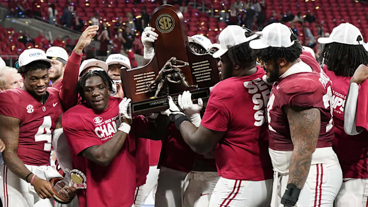 Dec 2, 2023; Atlanta, GA, USA; The Alabama Crimson Tide react after defeating the Georgia Bulldogs for the SEC Championship at Mercedes-Benz Stadium. Mandatory Credit: Dale Zanine-Imagn Images