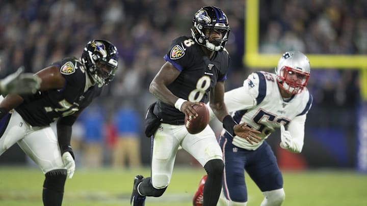 Nov 3, 2019; Baltimore, MD, USA; Baltimore Ravens quarterback Lamar Jackson (8) runs past New England Patriots linebacker Kyle Van Noy (53) during the fourth quarter at M&T Bank Stadium. Mandatory Credit: Tommy Gilligan-Imagn Images
