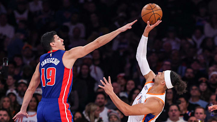 Dec 7, 2024; New York, New York, USA; New York Knicks guard Josh Hart (3) shoots the ball as Detroit Pistons forward Simone Fontecchio (19) defends during the first half at Madison Square Garden. Mandatory Credit: Vincent Carchietta-Imagn Images