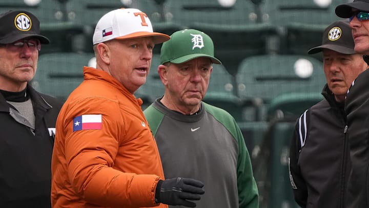Texas Longhorns head coach Jim Schlossnagle talks to Dartmouth head coach Bob Whalen ahead of the game