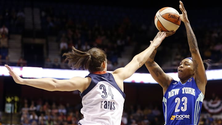 May 25, 2013; Uncasville, CT, USA; New York Liberty guard Cappie Pondexter (23) shoots against Connecticut Sun guard Kelly Faris (34) during the first half at Mohegan Sun Arena. Mandatory Credit: David Butler II-Imagn Images