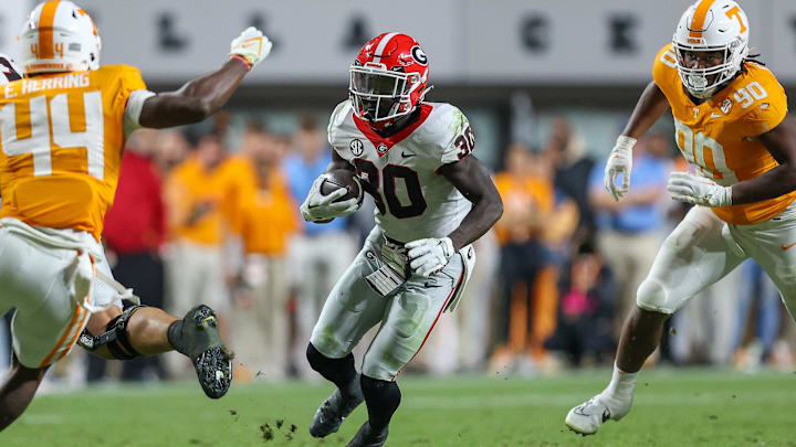 Nov 18, 2023; Knoxville, Tennessee, USA; Georgia Bulldogs running back Daijun Edwards (30) runs the ball against the Tennessee Volunteers during the second half at Neyland Stadium. Mandatory Credit: Randy Sartin-Imagn Images Nov 18, 2023; Knoxville, Tennessee, USA; Georgia Bulldogs running back Daijun Edwards (30) runs the ball against the Tennessee Volunteers during the second half at Neyland Stadium. Mandatory Credit: Randy Sartin-Imagn Images