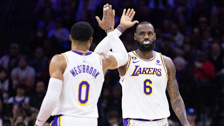 Dec 9, 2022; Philadelphia, Pennsylvania, USA: Los Angeles Lakers forward LeBron James (6) and guard Russell Westbrook (0) high five after a score against the Philadelphia 76ers during the second quarter at Wells Fargo Center. Mandatory Credit: Bill Streicher-Imagn Images