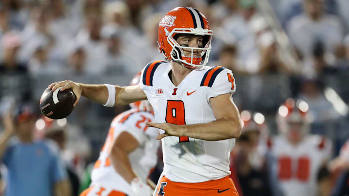 Sep 28, 2024; University Park, Pennsylvania, USA; Illinois Fighting Illini quarterback Luke Altmyer (9) throws a pass during the first quarter against the Penn State Nittany Lions at Beaver Stadium. Mandatory Credit: Matthew O'Haren-Imagn Images