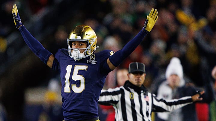 Notre Dame cornerback Leonard Moore (15) celebrates interrupting a reception attempt during the first round of the College Football Playoff between Notre Dame and Indiana at Notre Dame Stadium on Friday, Dec. 20, 2024, in South Bend.