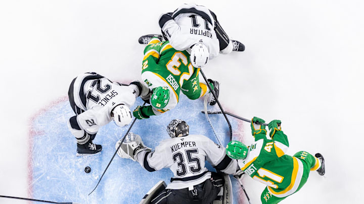 Mar 17, 2025; Saint Paul, Minnesota, USA;  Los Angeles Kings goaltender Darcy Kuemper (35) makes a save against the Minnesota Wild center Marco Rossi (23) in the third period at Xcel Energy Center.