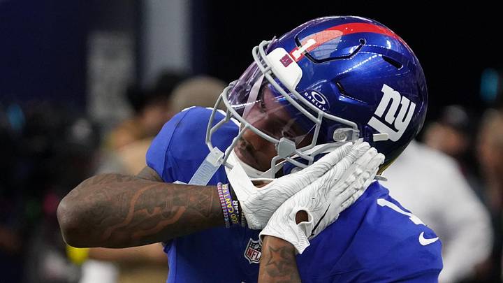 New York Giants wide receiver Malik Nabers (1) reacts after scoring a touchdown during the fourth quarter at AT&T Stadium. 