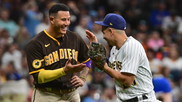 Aug 26, 2023; Milwaukee, Wisconsin, USA; San Diego Padres third baseman Manny Machado (13) and Milwaukee Brewers shortstop Willy Adames (27) smile together between innings at American Family Field. Mandatory Credit: Benny Sieu-Imagn Images Aug 26, 2023; Milwaukee, Wisconsin, USA; San Diego Padres third baseman Manny Machado (13) and Milwaukee Brewers shortstop Willy Adames (27) smile together between innings at American Family Field. Mandatory Credit: Benny Sieu-Imagn Images