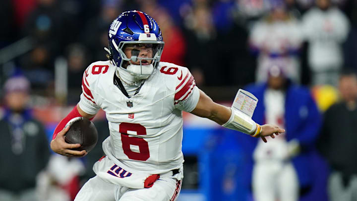 New York Giants quarterback Jaxson Dart (6) runs with the ball during the second quarter against the New England Patriots at Gillette Stadium. New York Giants quarterback Jaxson Dart (6) runs with the ball during the second quarter against the New England Patriots at Gillette Stadium.