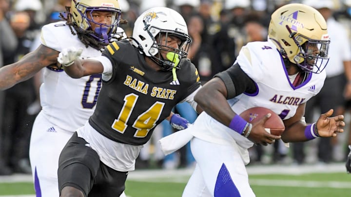 Alabama State defense back Adrian Maddox wraps up Alcorn quarterback Aaron Allen (4) during their game at Hornet Stadium in Montgomery, Ala., on Saturday September 30, 2023.