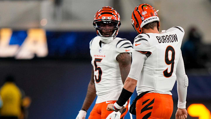 Cincinnati Bengals quarterback Joe Burrow (9) talks with wide receiver Tee Higgins (5) after a play as the punting team takes the field in the second quarter of the NFL Week 11 game between the Los Angeles Chargers and the Cincinnati Bengals at SoFi Stadium in Inglewood, Calif., on Sunday, Nov. 17, 2024. The Chargers led 24-6 at halftime.