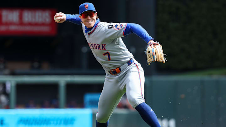 Apr 16, 2025; Minneapolis, Minnesota, USA; New York Mets third baseman Brett Baty (7) throws the ball to home plate to get out Minnesota Twins left fielder Harrison Bader (12) on a fielders choice hit by center fielder Byron Buxton (25) during the sixth inning at Target Field. Mandatory Credit: Matt Krohn-Imagn Images