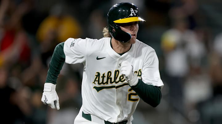 May 23, 2025; West Sacramento, California, USA; Athletics CJ Alexander (26) runs to first after hitting a single against the Philadelphia Phillies during the ninth inning at Sutter Health Park. Mandatory Credit: Dennis Lee-Imagn Images