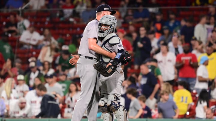 Jun 14, 2024; Boston, Massachusetts, USA; New York Yankees pitcher Michael Tonkin (50) and catcher Jose Trevino (39) celebrate beating the Boston Red Sox at Fenway Park. Mandatory Credit: Eric Canha-USA TODAY Sports